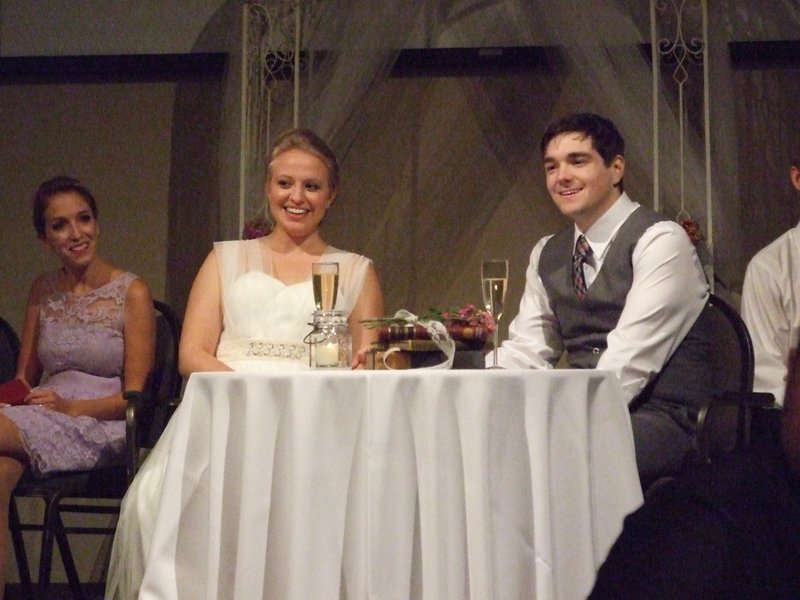 Andy and Katie listening to the toasts