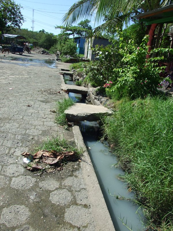 These streets had sewers but they were open and ended right in the yards of the people we were visiting