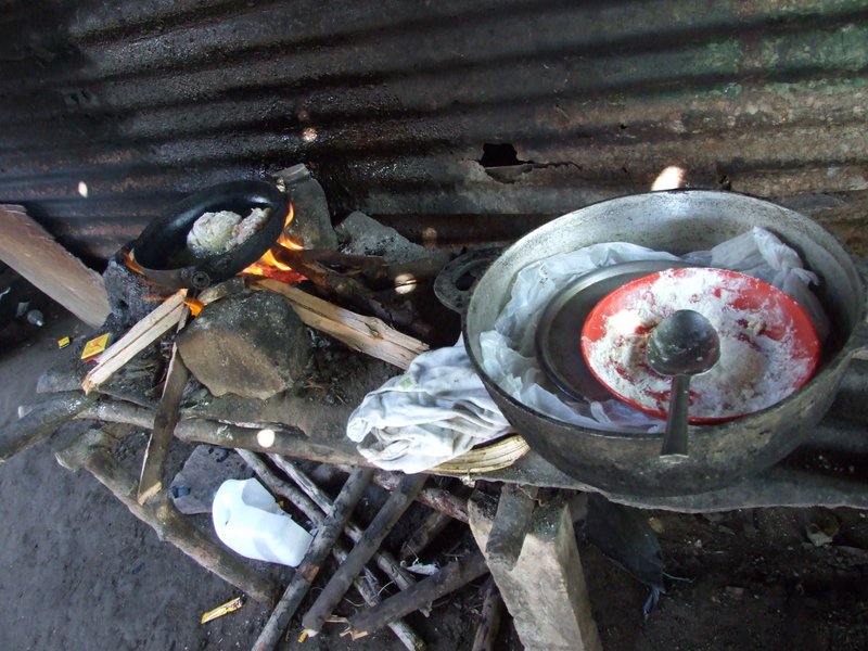 The cooking station at one of our home visits - she was cooking for the returning fishermen