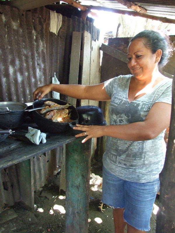 One of the neighbors showing her fish for the day