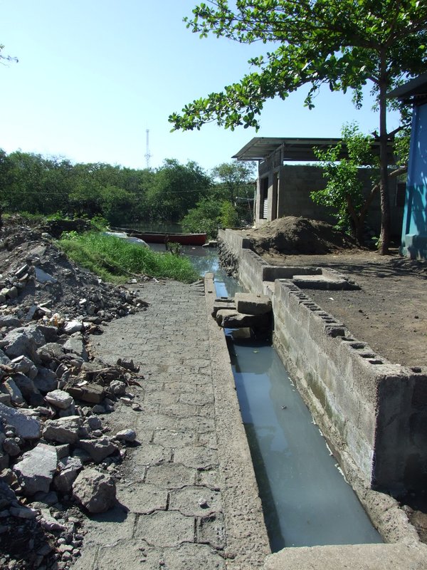 Now as the tide is coming in, you can see how this sewer empties right into the water behind their homes