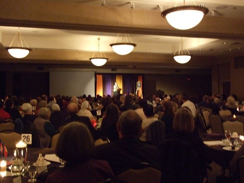 Presenting at the Remember Nhu benefit to aid children in danger of human trafficking