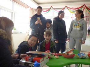 Getting gifts at the going away party at his orphanage