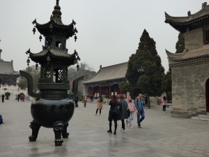 The entrance to the Wild Good Pagoda - look at the size of the burner next to the women!