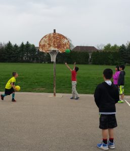 That’s Noah in red and that basket went in!  His favorite new thing on the playground.