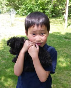 Holding his cousin’s new puppy.
