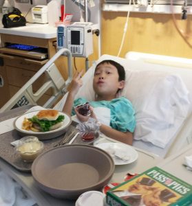 Noah recovering in the hospital after his heart catheterization