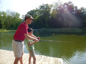 Noah trying fishing for the first time at Doctor Dan and Stevie’s lake