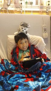 Picture from July 15th with the Husky on his head - first real smile in a while!